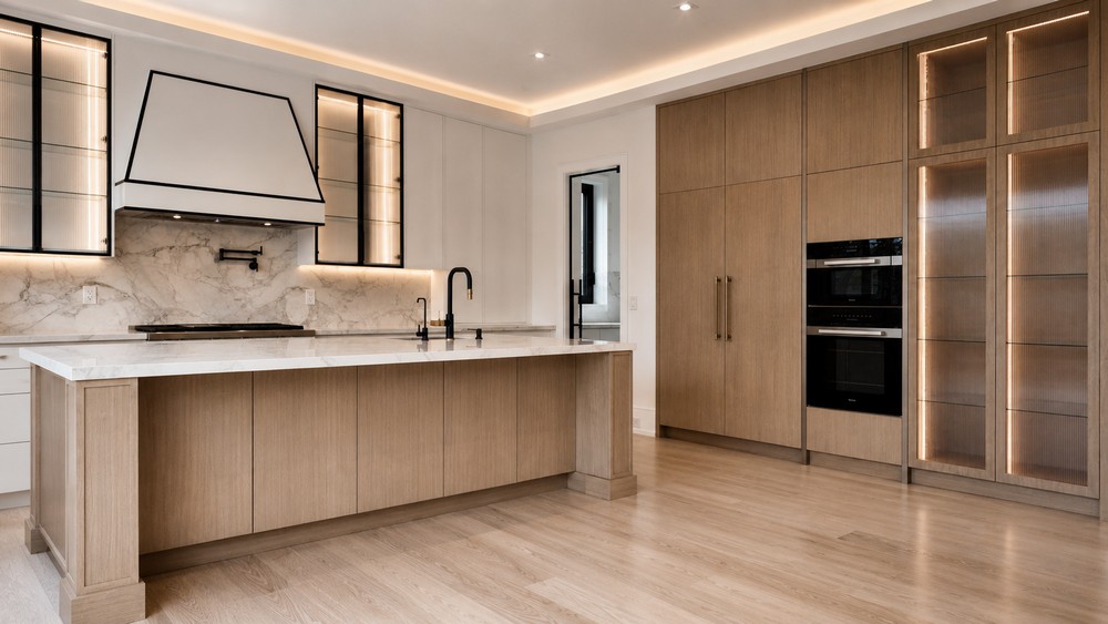 White oak island with marble countertop and custom hood