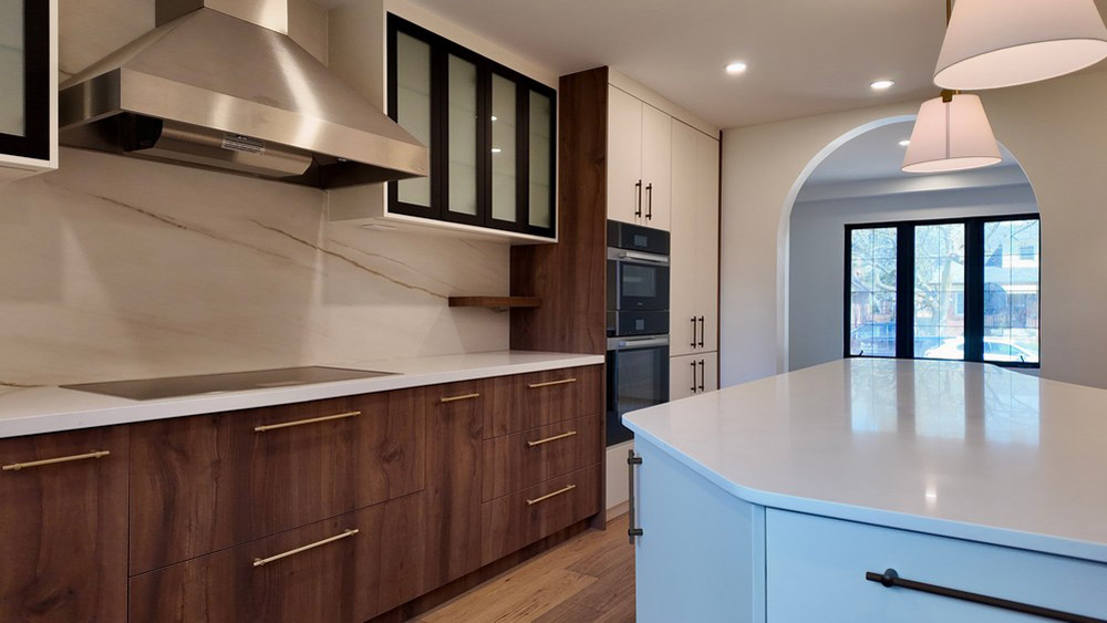 Miele fully integrated dishwasher behind a matching walnut panel