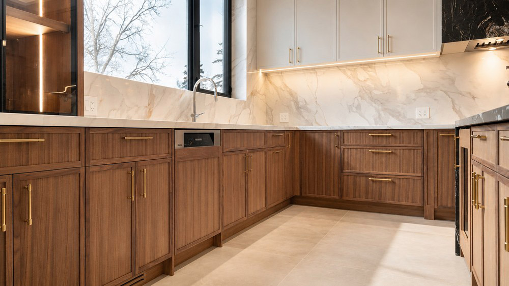 Miele panel-ready dishwasher integrated into the walnut run