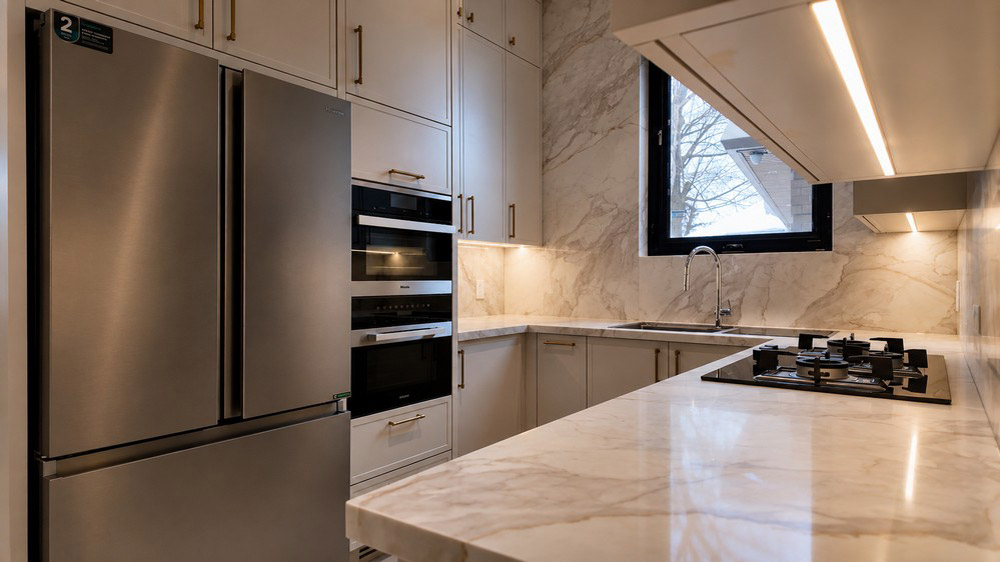 Secondary kitchen with Hisense refrigerator, Miele wall oven and FOTILE gas cooktop