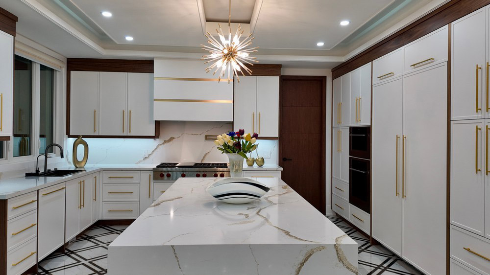 Waterfall quartz island beneath a sputnik chandelier
