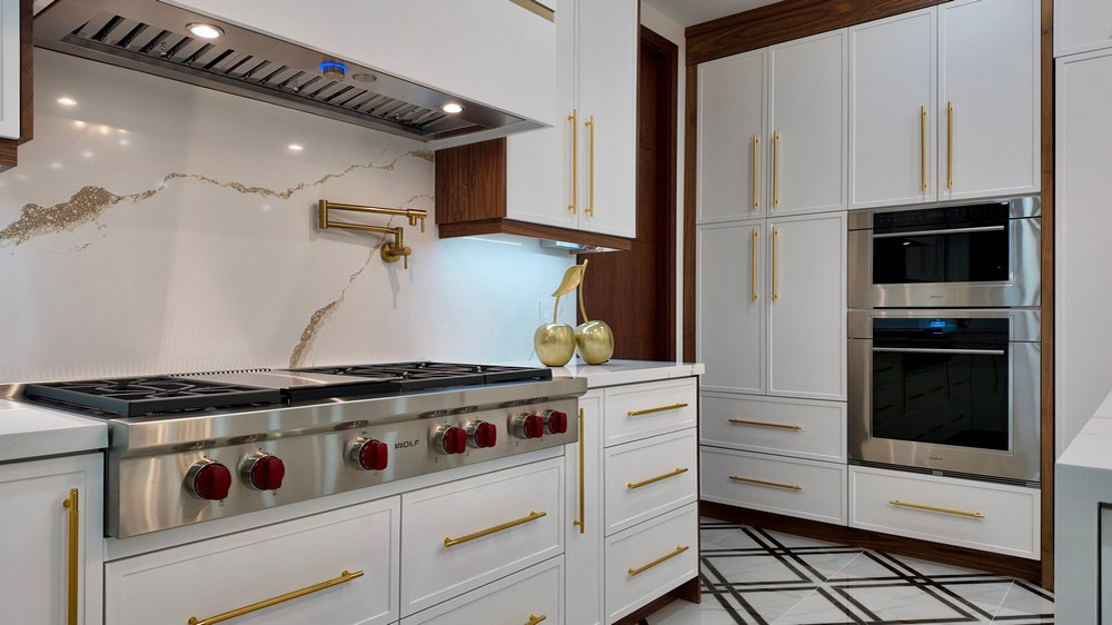Wolf professional gas rangetop with red control knobs and Elica hood
