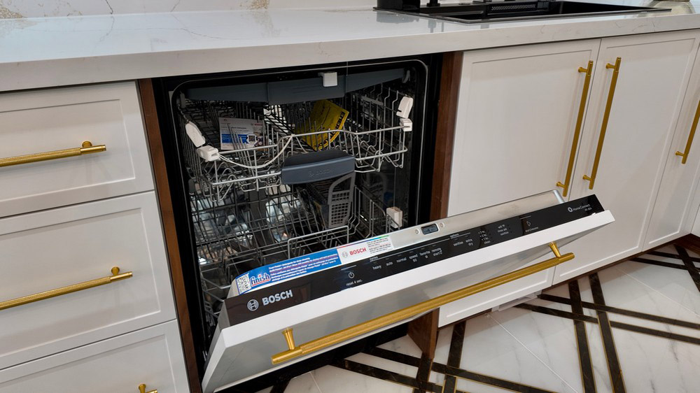 Bosch panel-ready dishwasher integrated into the white cabinetry