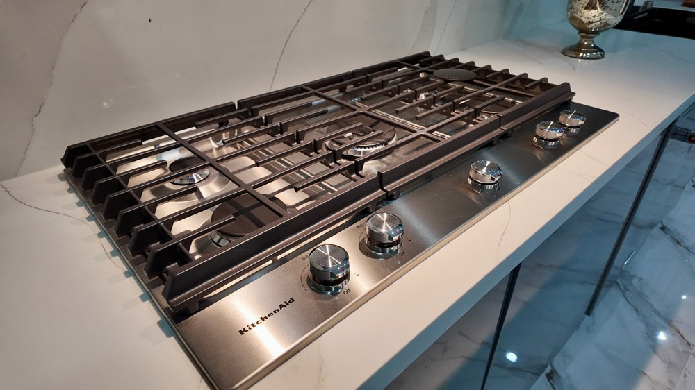 KitchenAid built-in gas cooktop set into quartz countertop