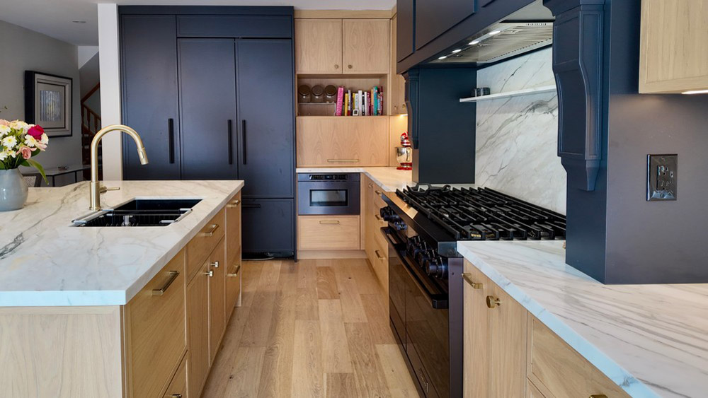 JennAir panel-ready refrigerator integrated into the dark tall cabinetry