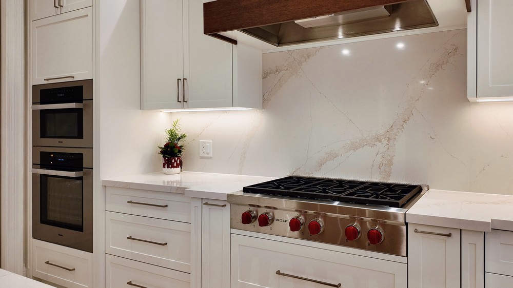 Wolf sealed burner rangetop beneath the Vent-A-Hood built-in hood