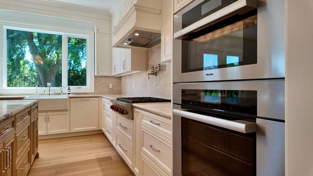 Miele speed oven and convection oven beside the sink run